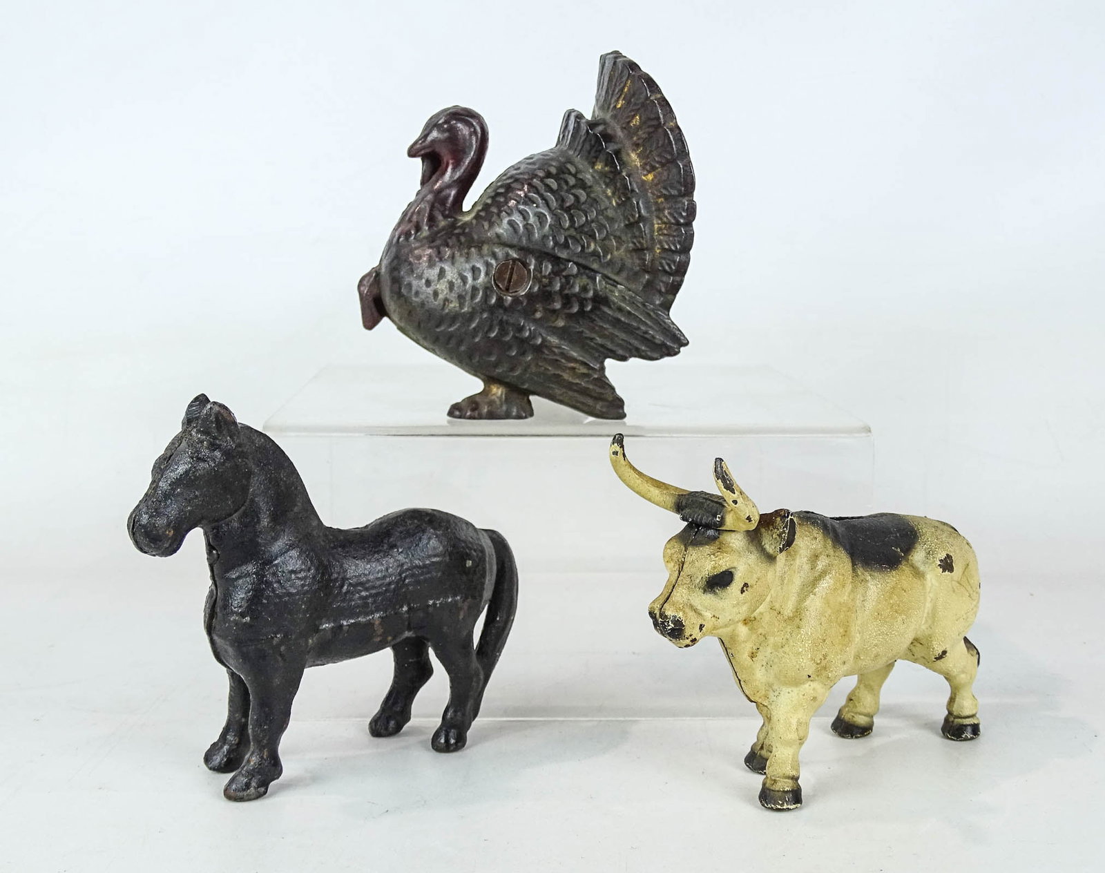 Bank Lot: Lot (3) cast iron banks including turkey, bull and horse. Tallest 4" Ht..