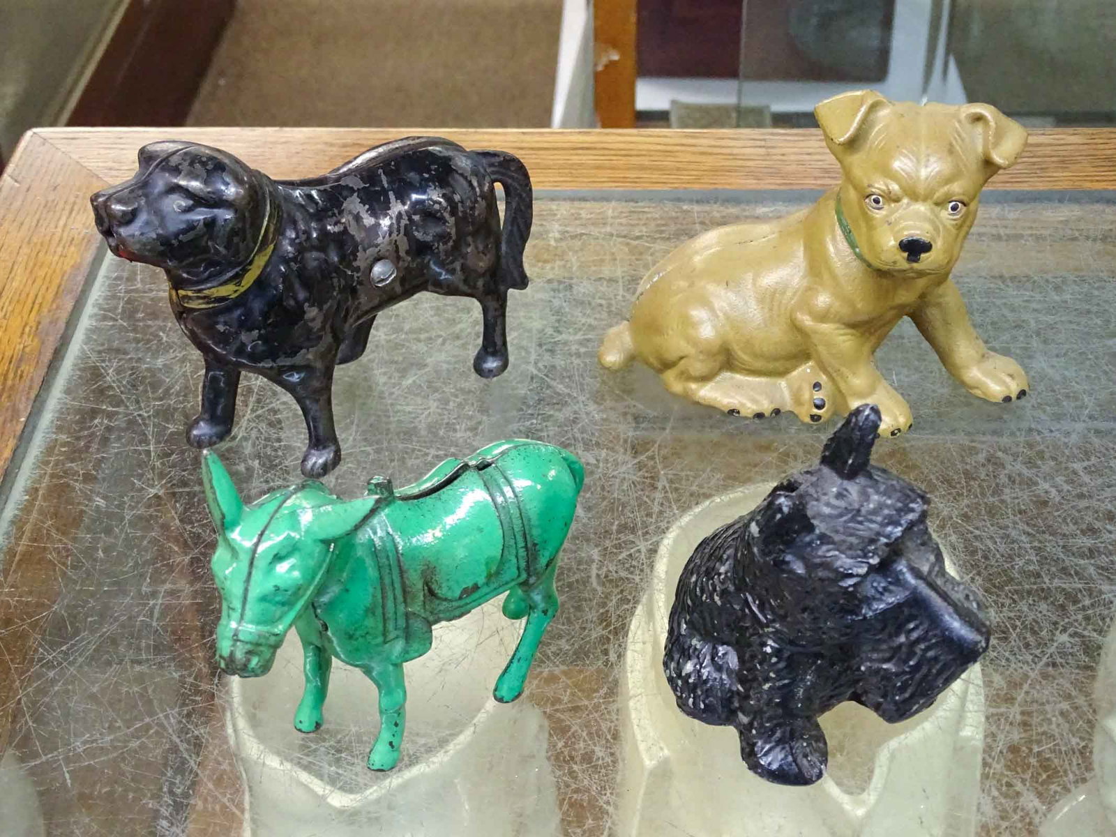 Bank Lot: Lot including (2) cast iron dog banks, cast metal dog, cast iron donkey. Tallest 5" Ht..