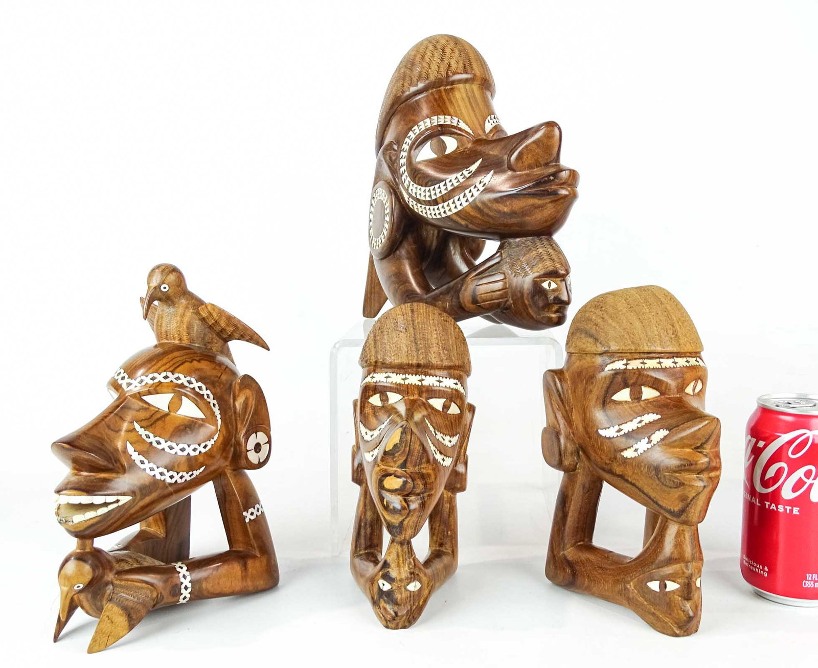 Solomon Island Carvings: Lot (4) kerosene wood Solomon Island mother of pearl wooden figures. Tallest 9 1/2" Ht..