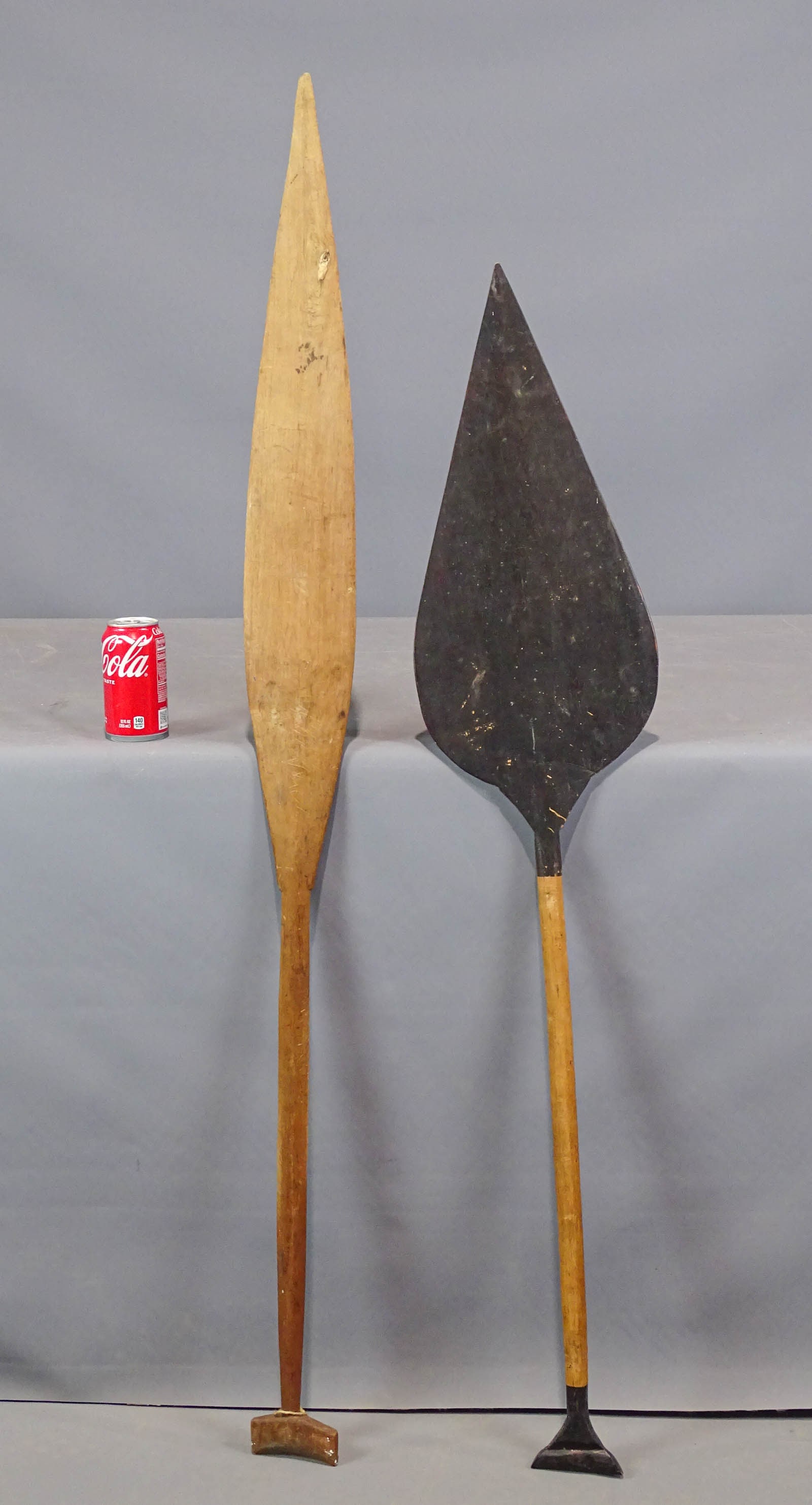 South Pacific Wooden Paddles: Two South Pacific wooden paddles. 48" and 55 1/2" L..