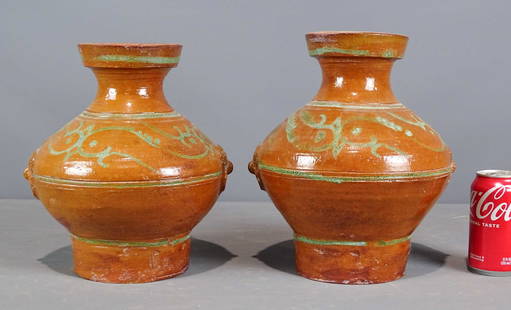 Redware Pottery Vessels: Two redware slip decorated pottery vessels. Tallest 12" Ht..