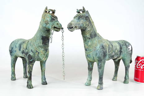 Chinese Bronze Horses: Two Chinese bronze horses. 15" L..