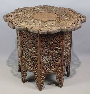 Moroccan Carved Table: Moroccan carved table. Top 29" D., 24" Ht..