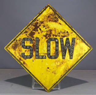 Vintage Sign: Vintage sign "SLOW". Glass marble reflectors. 24" D..