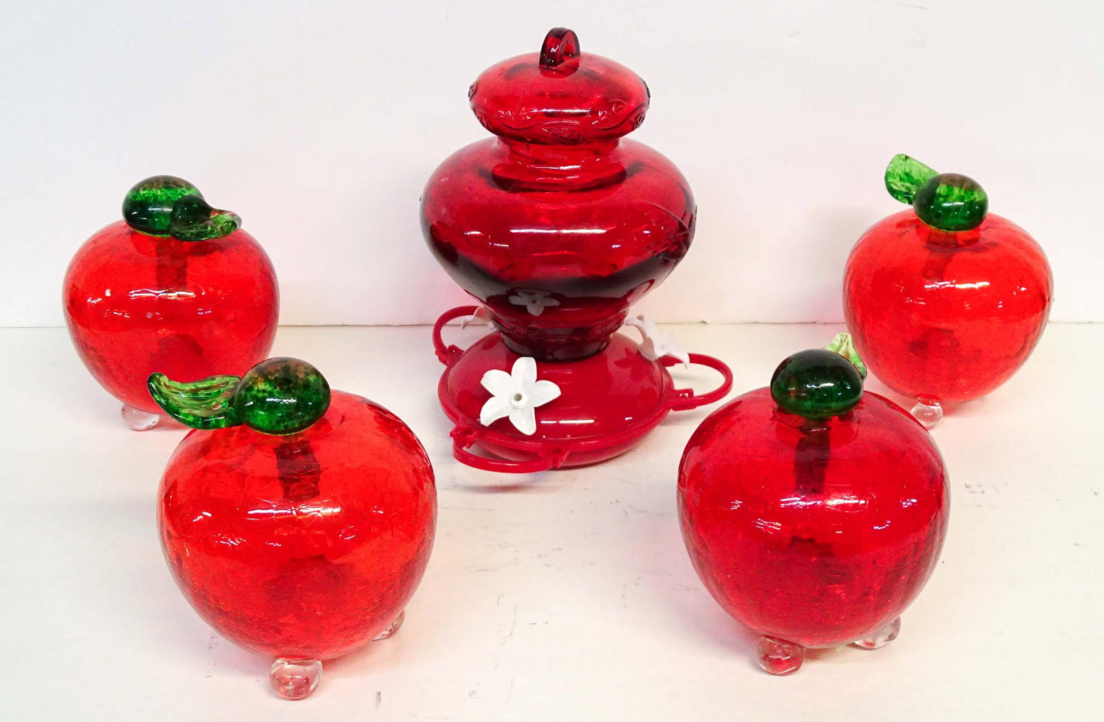 Bird Feeders: Lot of glass apple feeders and hummingbird feeder.
