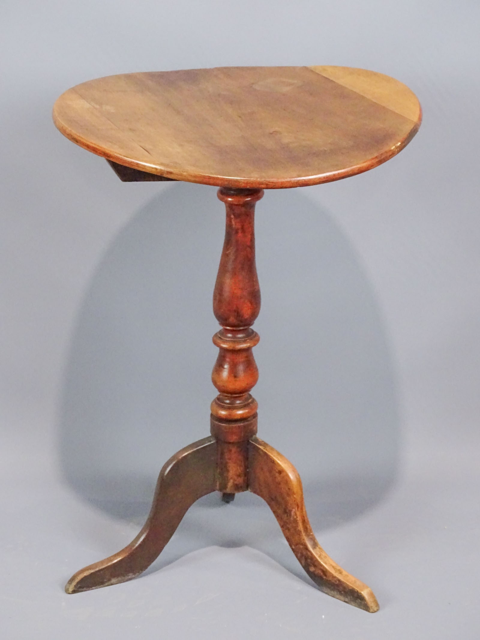 18th c. Candlestand: 18th c. snake leg candlestand. 19" D., 27 1/2" Ht.. Top warped, as found.