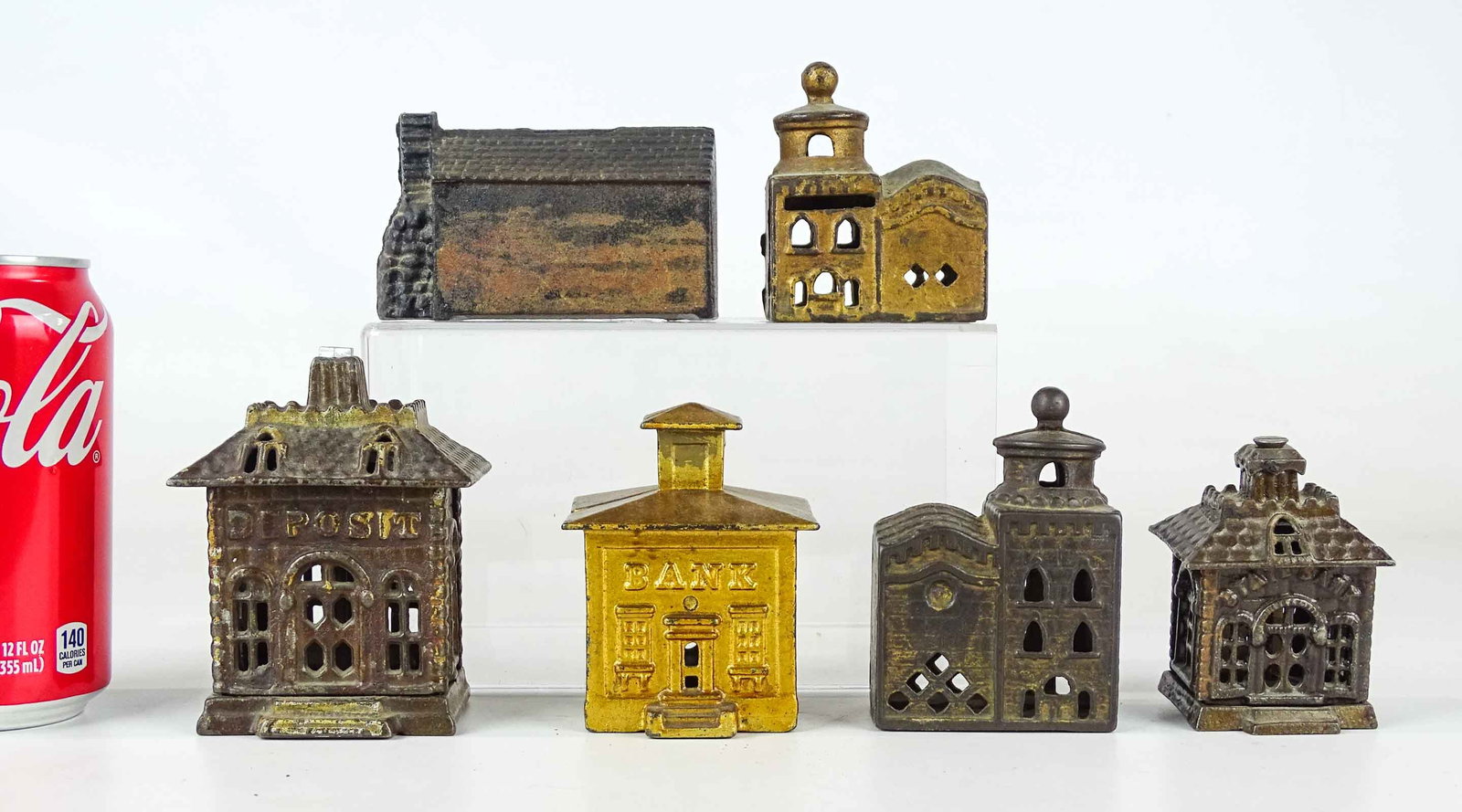 Bank Lot: Lot (6) early cast iron building banks. Tallest 4 1/2" Ht..