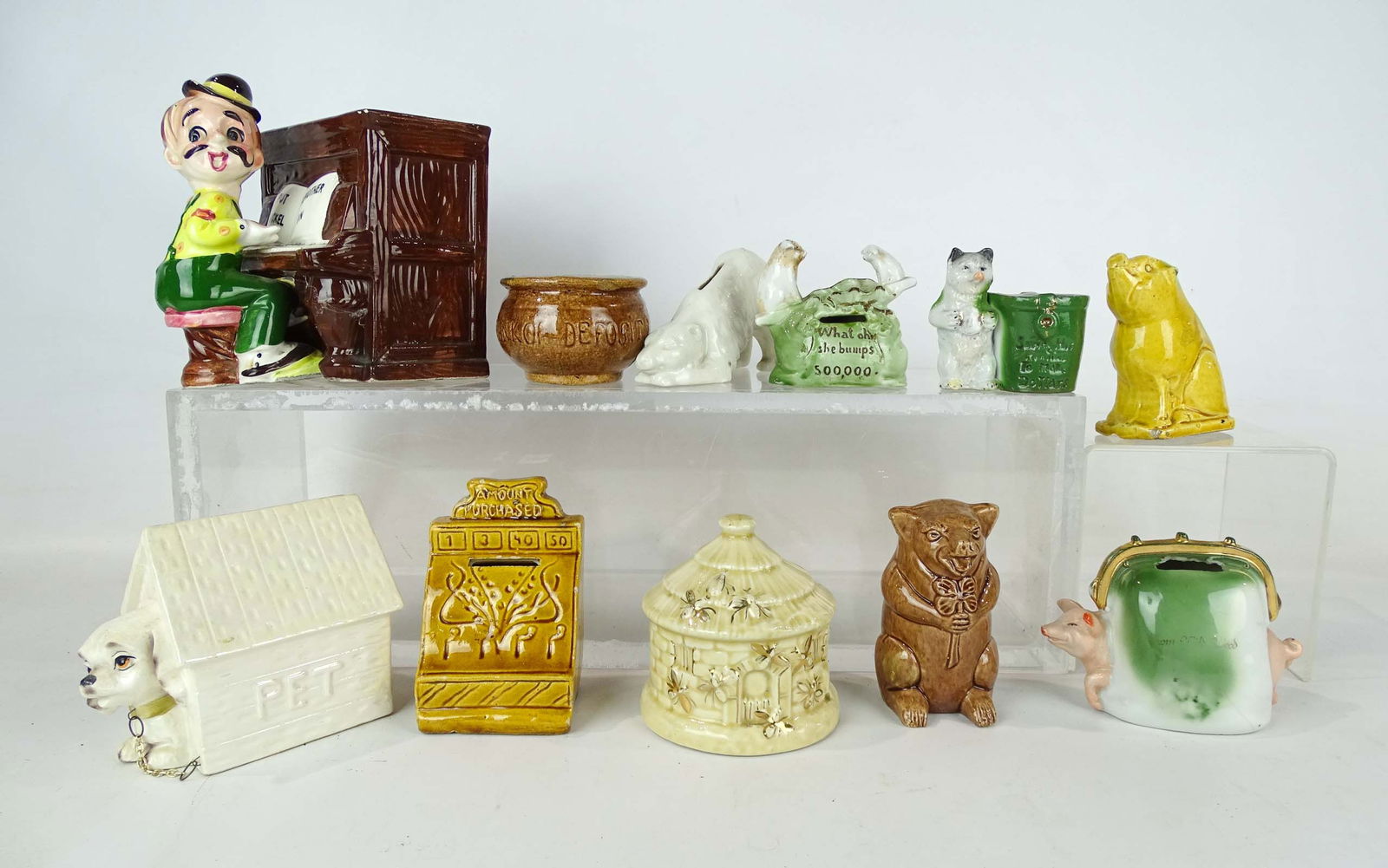 Bank Lot: Lot (11) ceramic banks including animals, piano player, cash register, beehive etc..