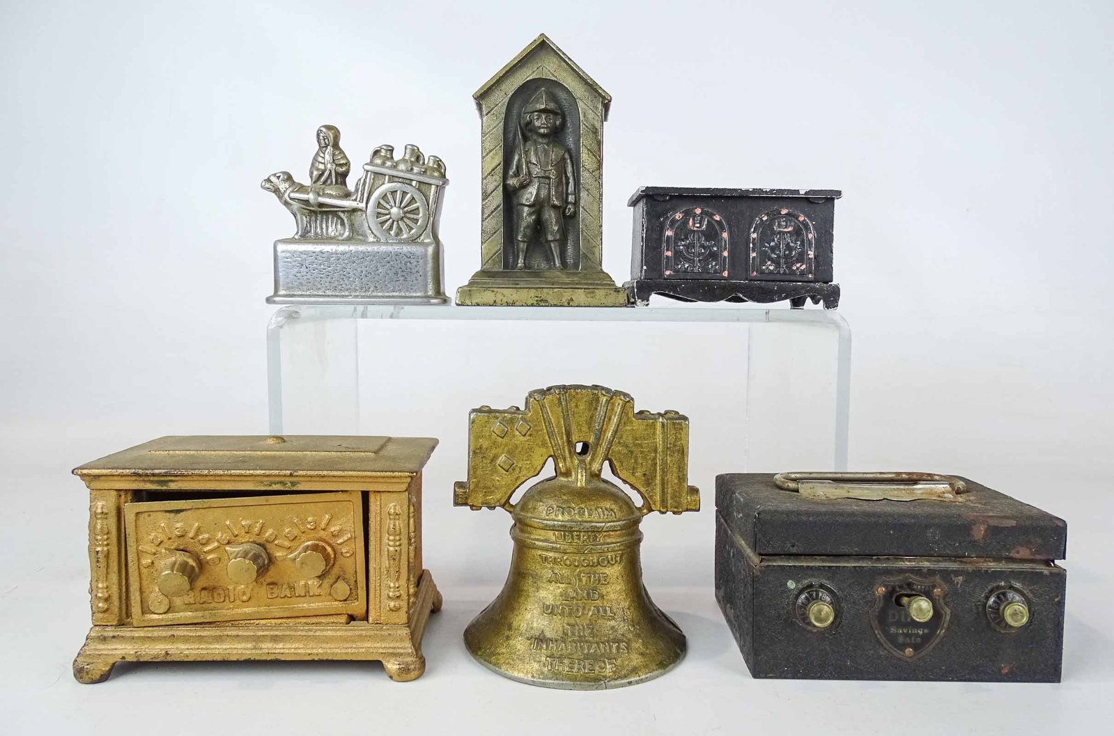 Bank Lot: Lot (6) metal banks including Liberty bell, safes, "SIXPENNY PENCE" etc.. Tallest 5" Ht..