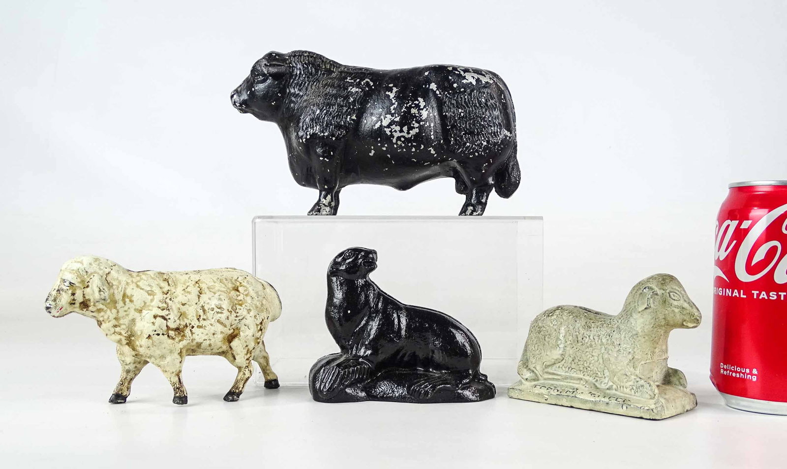 Bank Lot: Lot (4) cast metal banks including seal, (2) sheep and bull. Tallest 4 1/2" Ht..