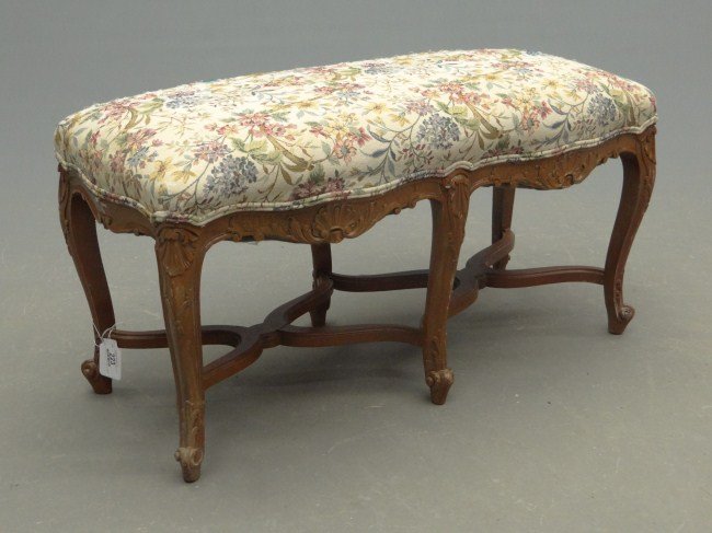 Upholstered Bench: Upholstered bench with carved stretcher base and needlepoint seat. 37" W.