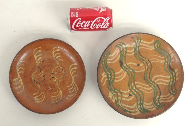 Redware Lot: Lot two decorated redware plates, 8" and 9 1/2" Diameter.