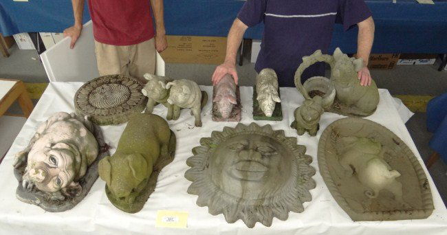 Outdoor Pig Sculptures: Lot 10 cement outdoor sculptures including pigs, sun etc.