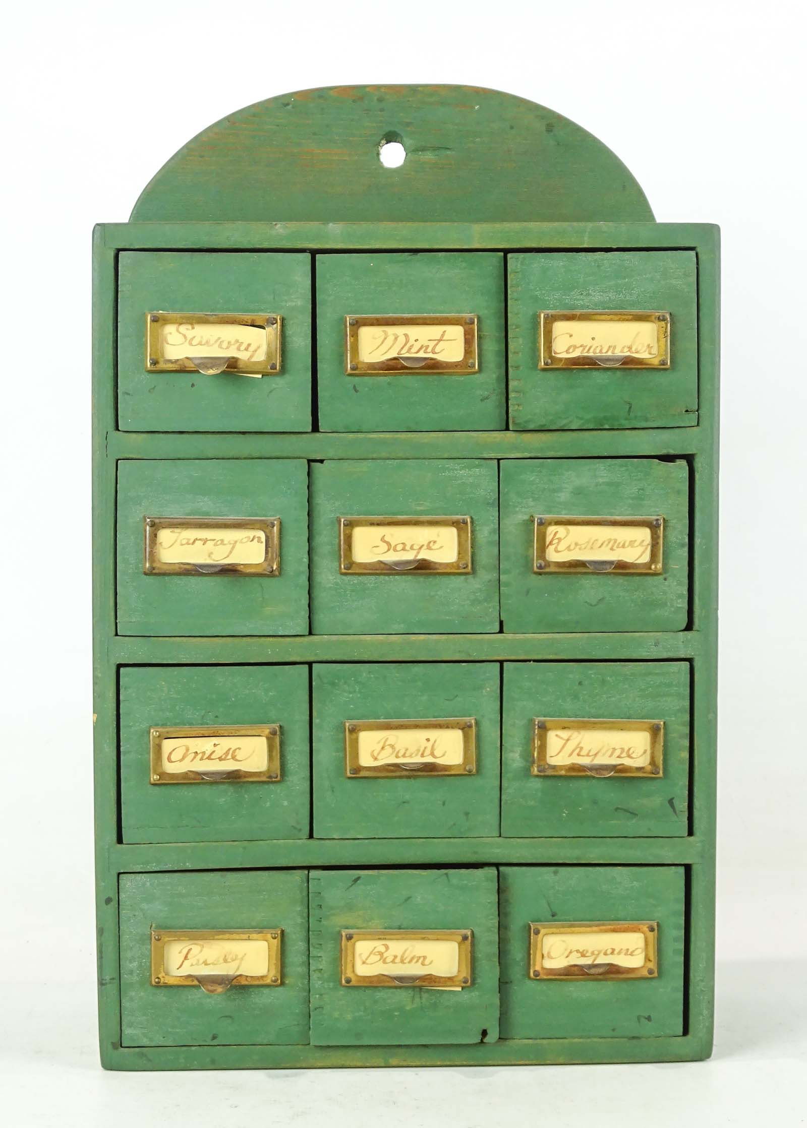 Apothecary Cabinet: Hanging apothecary cabinet in green paint. 9" x 5" x 15". Provenance: Ed and Anita Holden Collection.