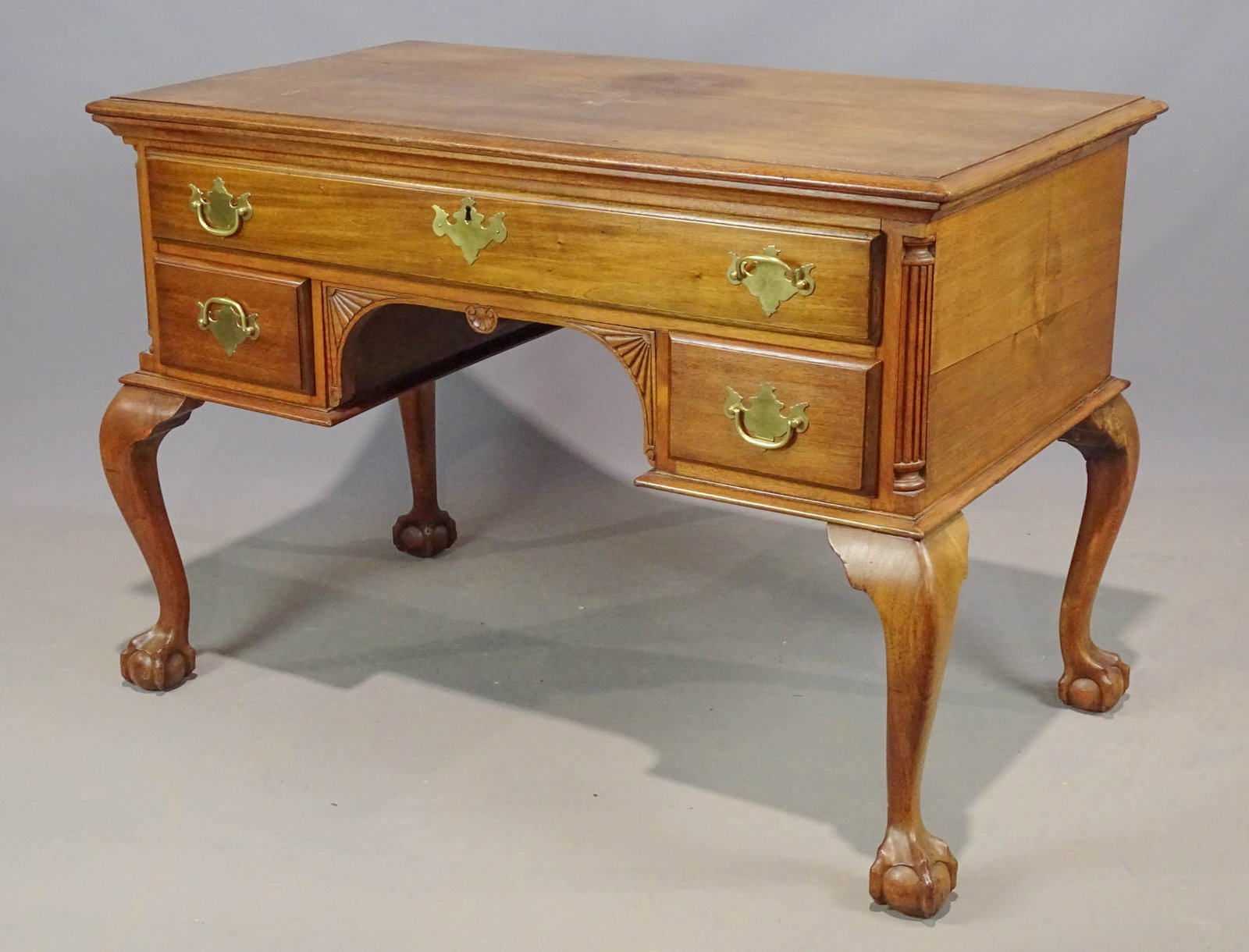 Chippendale Style Desk: C. 1900's Chippendale style flat top ball and claw foot desk. 42" x 24" x 29" Ht.. Provenance: Ed and Anita Holden Collection.