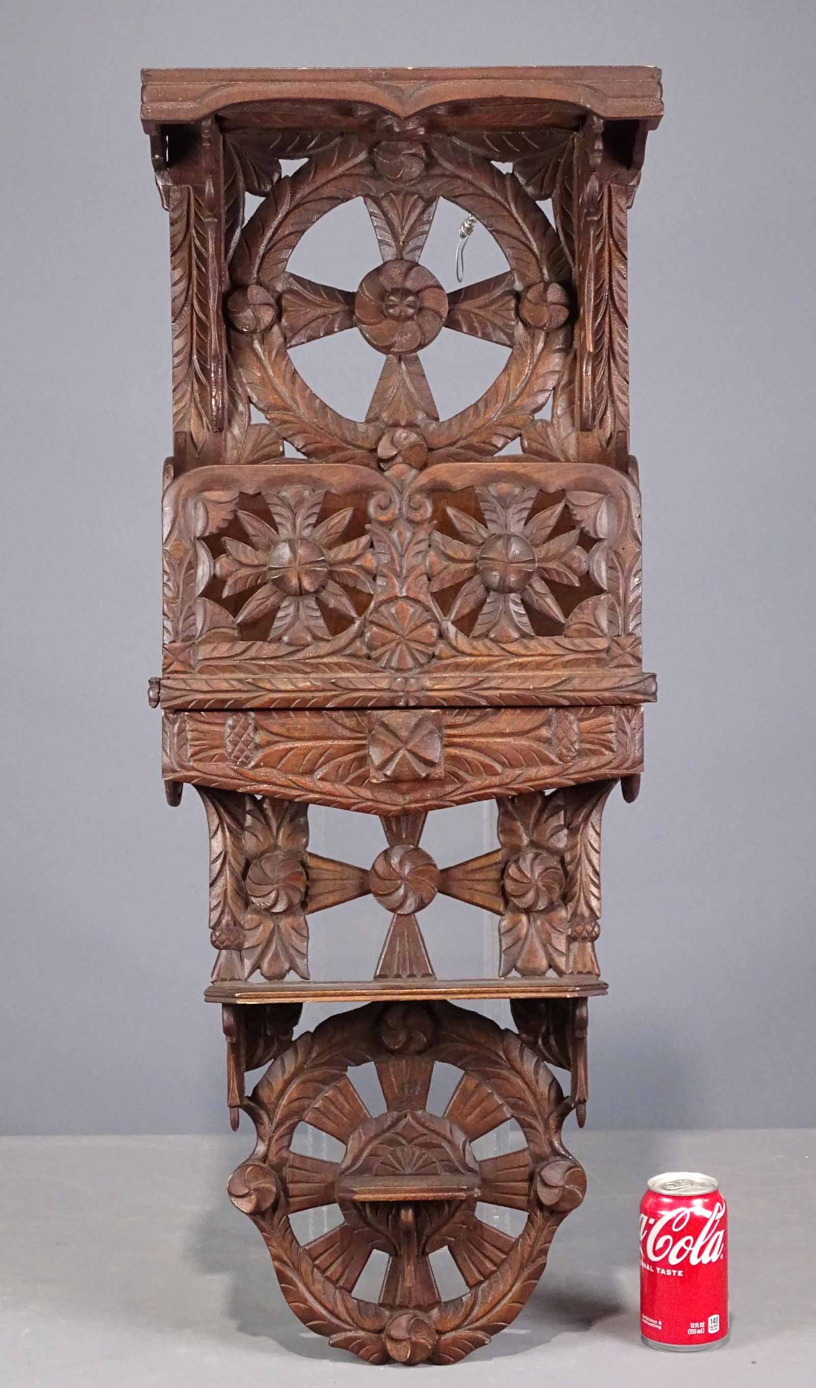 19th c. Folk Art Shelf: 19th c. carved wooden folk art shelf with drawer. 15" x 6 1/2" x 37". Provenance: Ed and Anita Holden Collection.