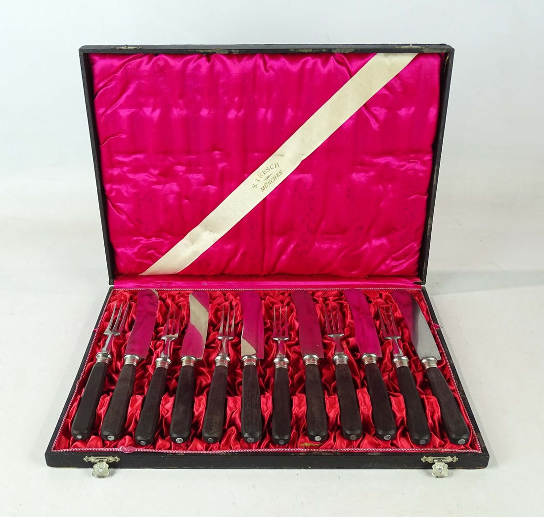 German Boxed Flatwear: Early boxed German flatwear. Case overall 16" x 12" x 2". Provenance: Ed and Anita Holden Collection.