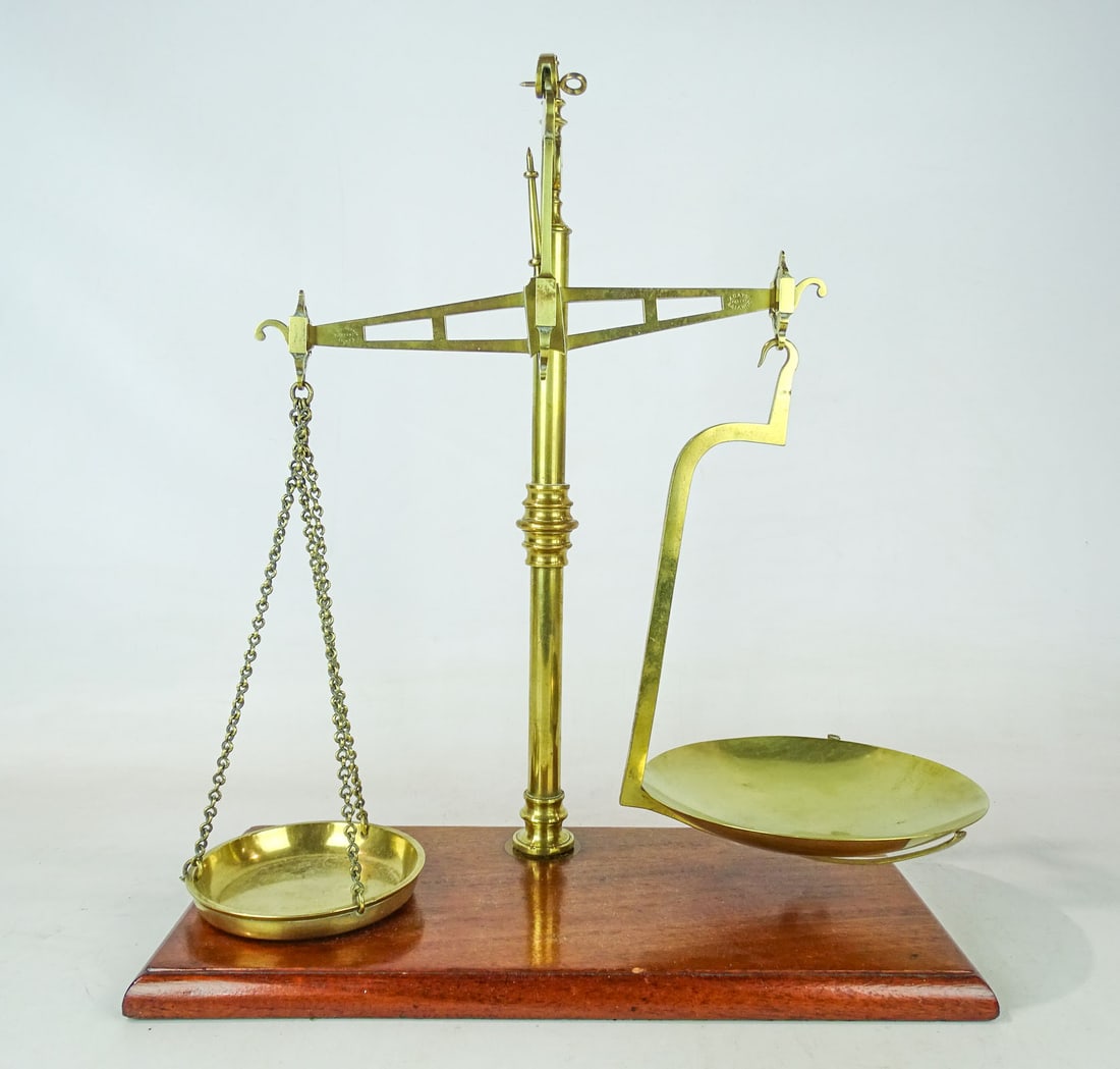 19th c. Scale: 19th c. brass scale with wooden base. 23" Ht.. Marked Rogers & Co….". Provenance: Ed and Anita Holden Collection.