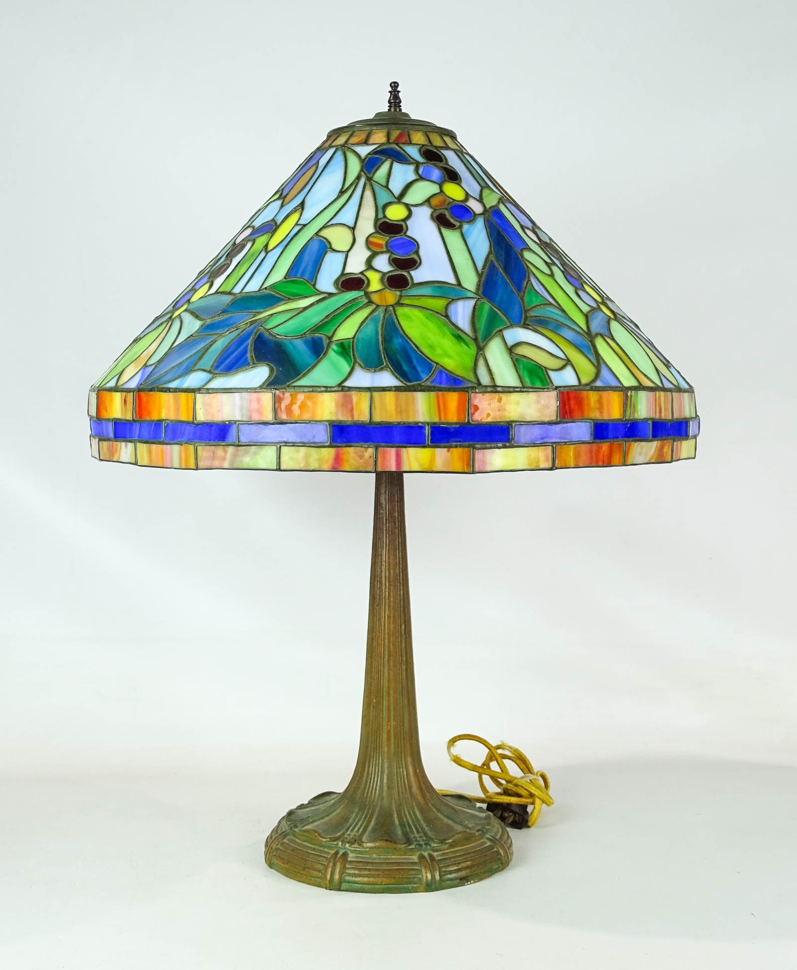 Stained Glass Table Lamp: Stained glass metal base table lamp. 26" Ht.. Needs rewiring.