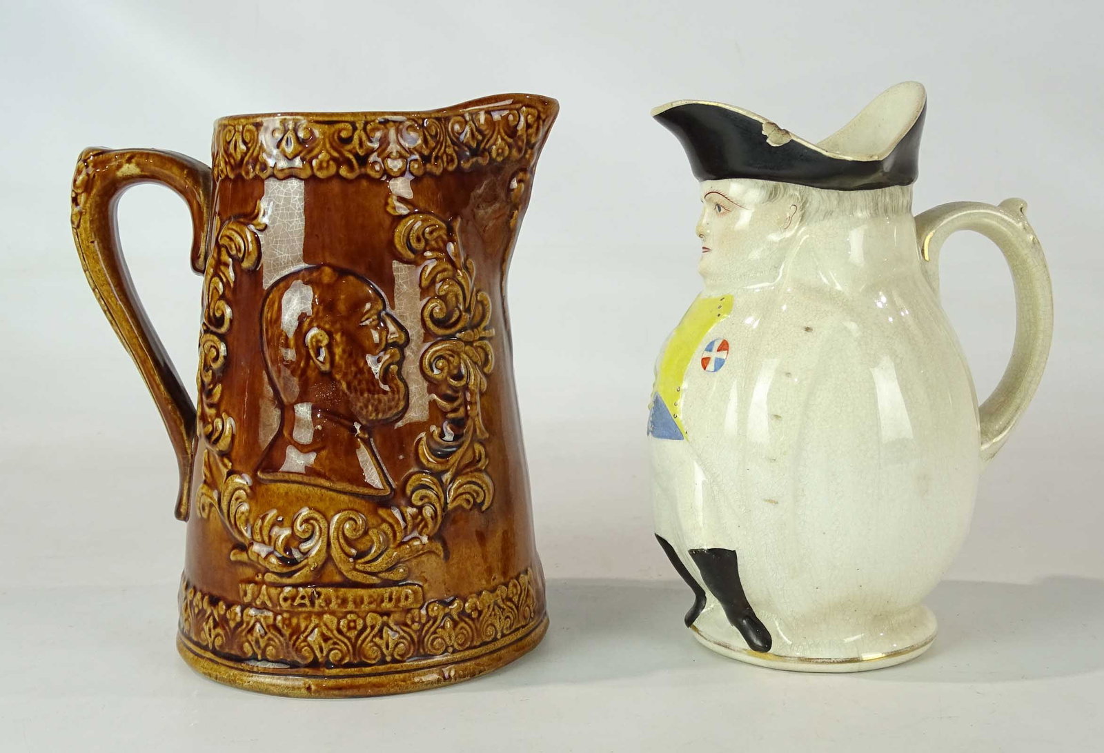 Garfield & McKinley Pitchers: Lot including Mckinley (as Napoleon) pitcher (9 1/2" Ht., as found), and Garfield pitcher (9" Ht.).