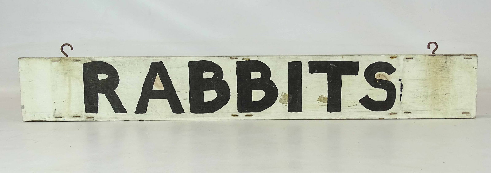 Trade Sign: Painted wooden two sided trade sign "RABBITS". 4 1/2" x 31 1/2".