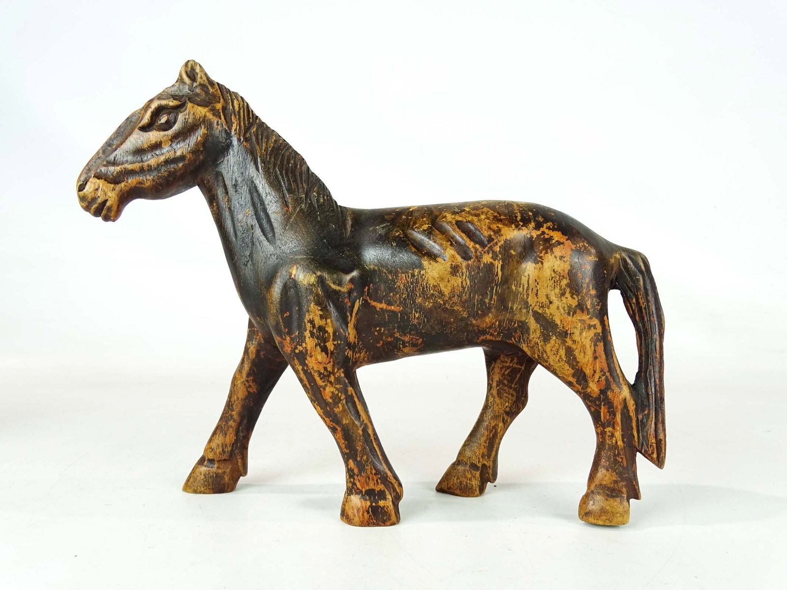 Folk Art Carved Horse: Early folk art wooden carved wooden horse. Old finish. 11" L., 9" Ht..