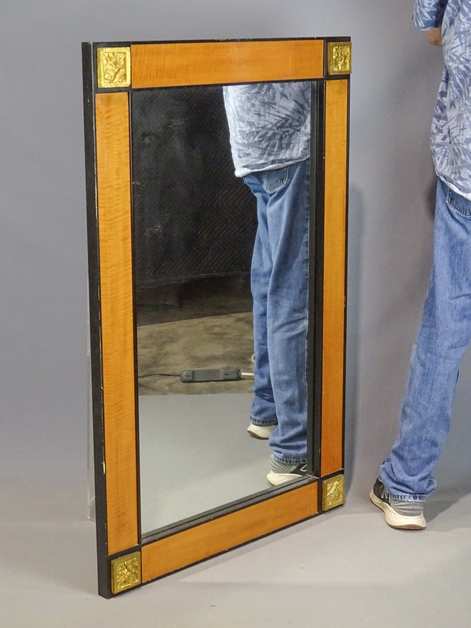 Biedermeir Style Mirror: Biedermeir style Mirror with blond wood panels and black ebonized moldings. Hicks frame type block corners. 20th Century. Overall 48" x 32".