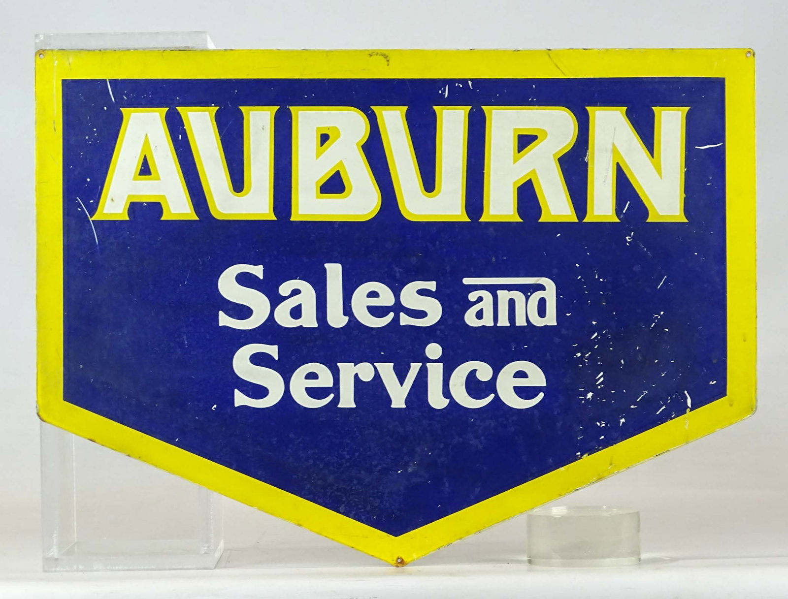 Automotive Metal Trade Sign: "Auburn Sales and Service" metal trade sign. 18 1/2" x 25 1/2". Provenance: The Edward Herrmann Estate, Salisbury Connecticut.