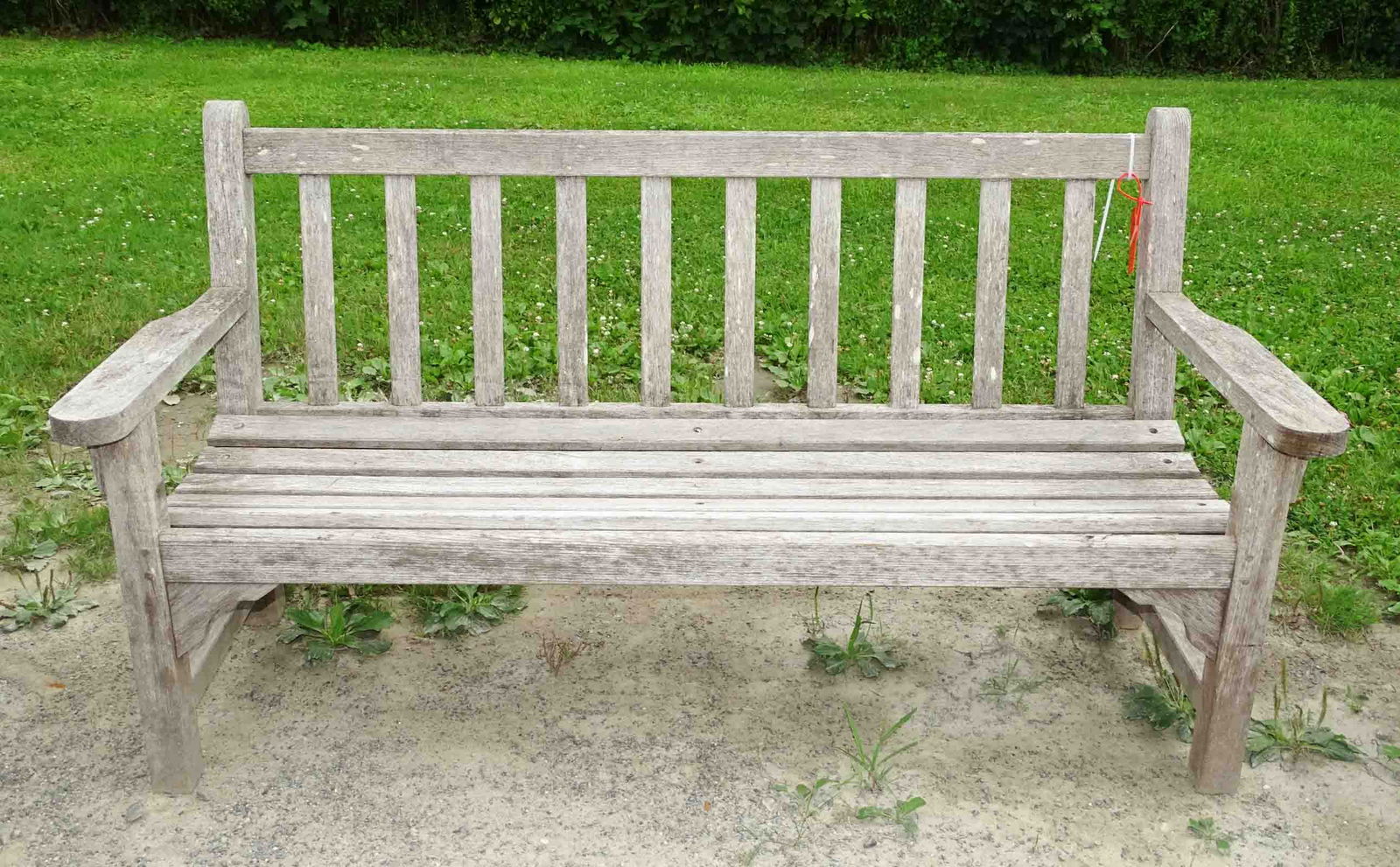 Teak Settee: Teak settee. 61" W., 15" seat Ht..