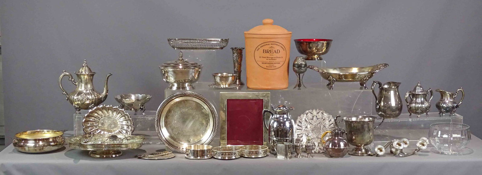 Silverplate Lot: Silverplate lot including lazy susan, pitcher, vases, bowls, wine coasters. Along with an English pottery bread crock.