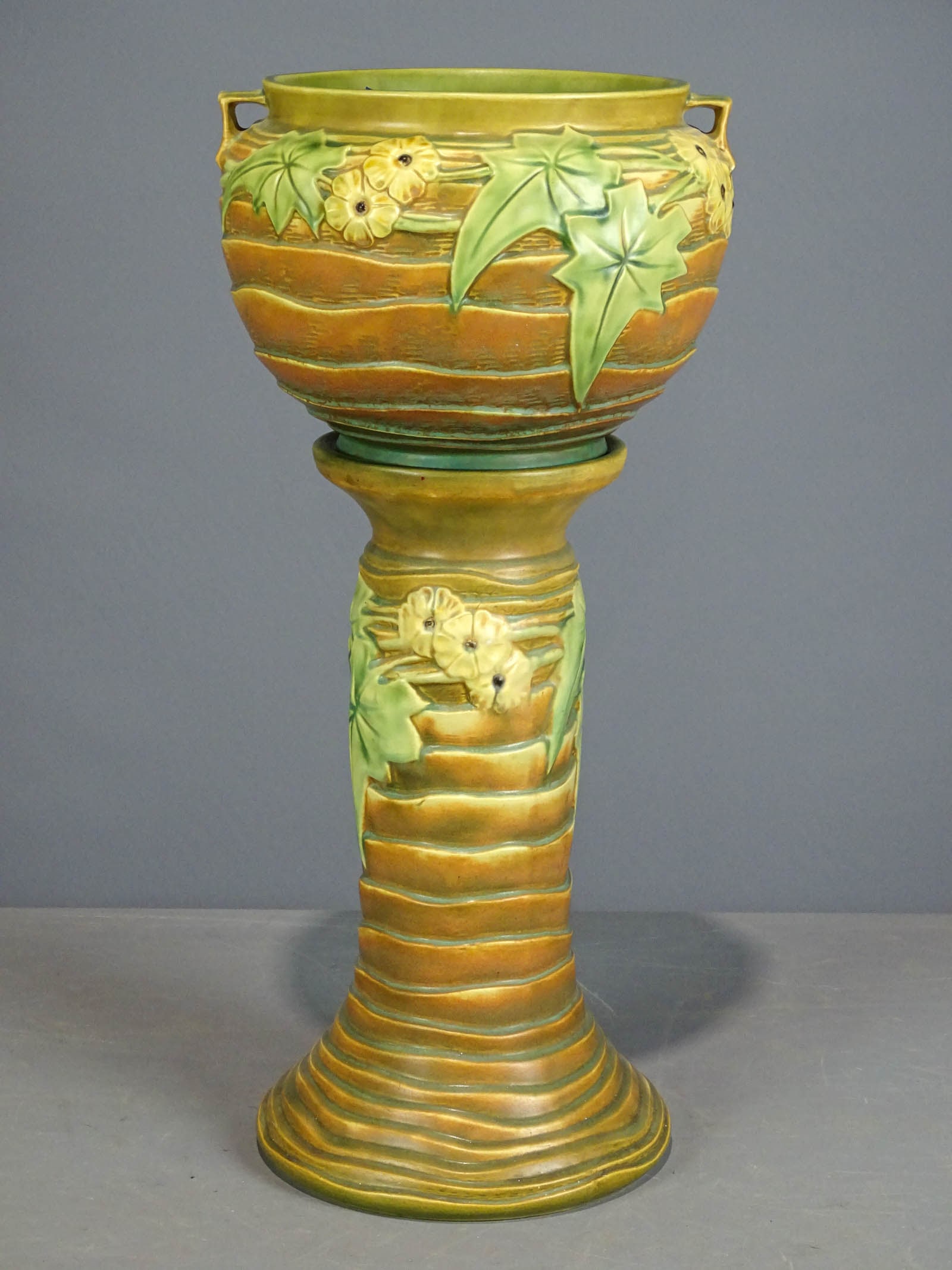 Roseville Jardiniere and Pedestal: Roseville Jardiniere and pedestal. Barbara Packer Collection. 25" Ht.. Slight imperfection rim base, otherwise good condition.