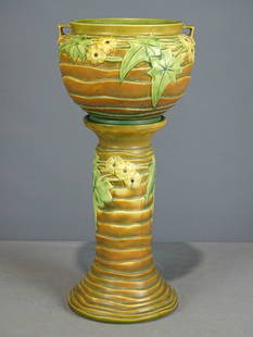 Roseville Jardiniere and Pedestal: Roseville Jardiniere and pedestal. Barbara Packer Collection. 25" Ht.. Slight imperfection rim base, otherwise good condition.