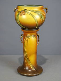 Roseville Jardiniere and Pedestal: Roseville Jardiniere and pedestal. Barbara Packer Collection. 25 1/2" Ht.. Hairline along rim of top, crazing to base, otherwise good condition.