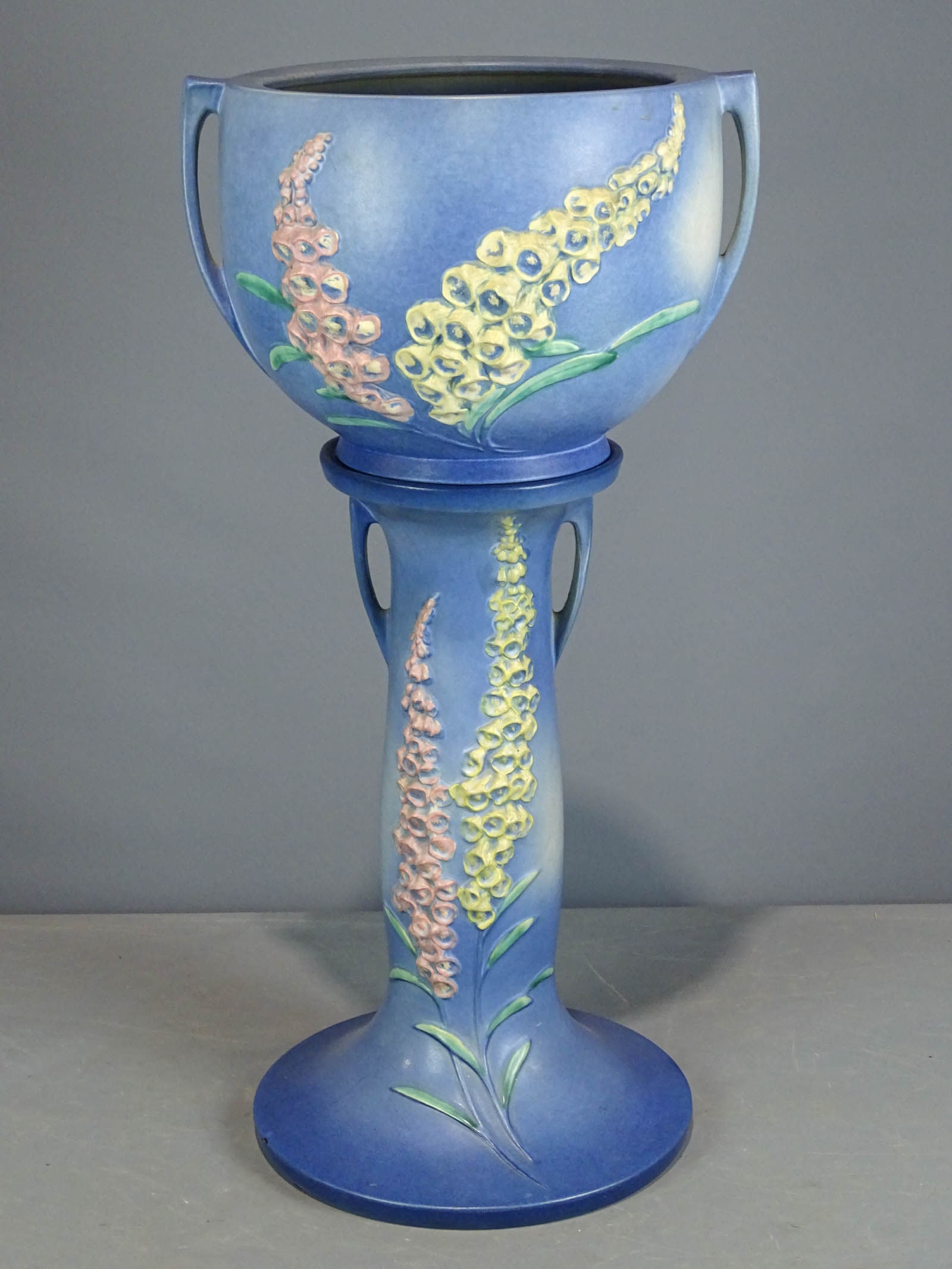 Roseville Jardiniere and Pedestal: Roseville Jardiniere and pedestal. Barbara Packer Collection. 31" Ht.. Base has some defects, chip, top has a line.