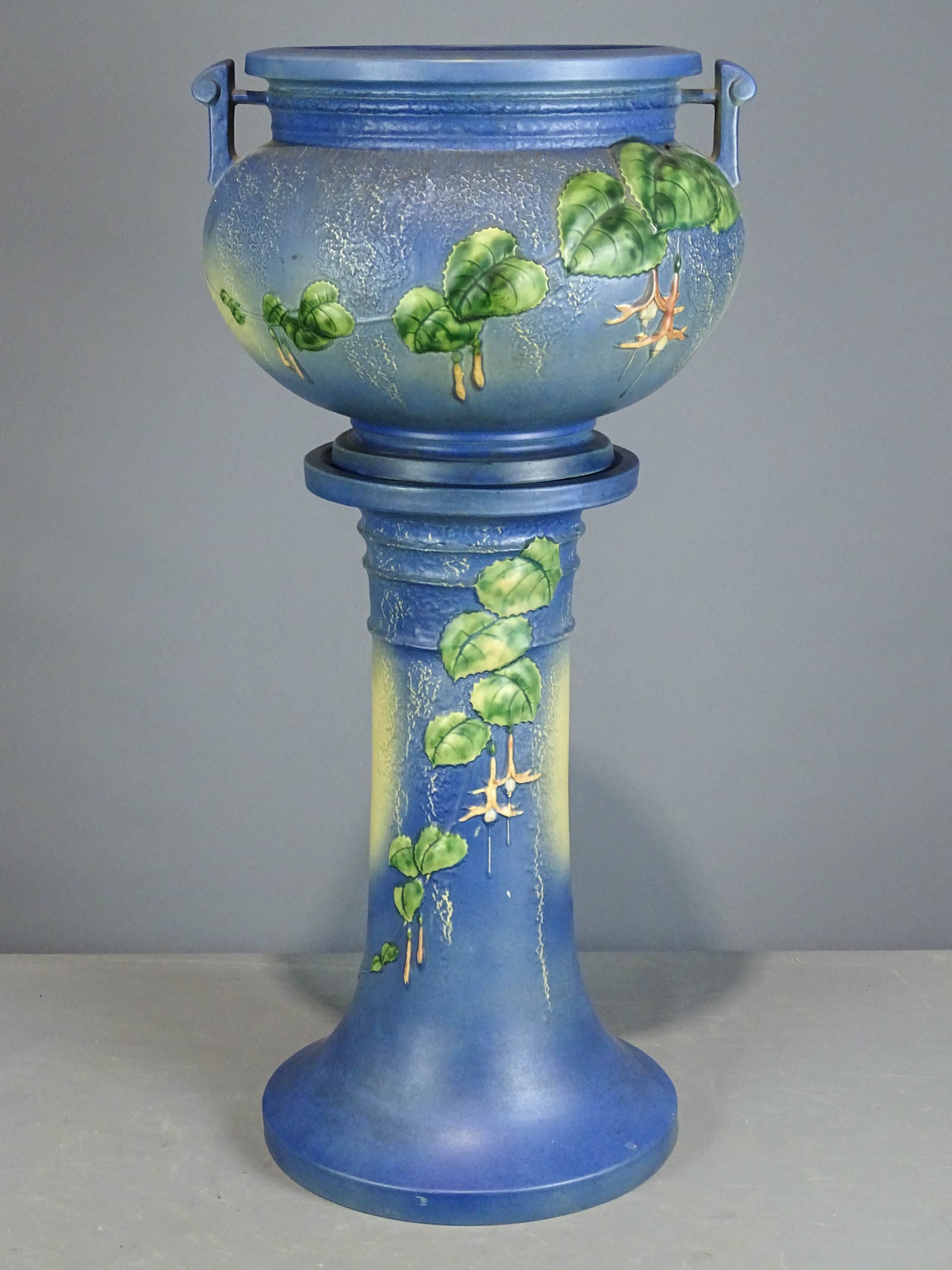 Roseville Jardiniere and Pedestal: Roseville Jardiniere and pedestal. Barbara Packer Collection. 33" Ht.. Overall good condition.