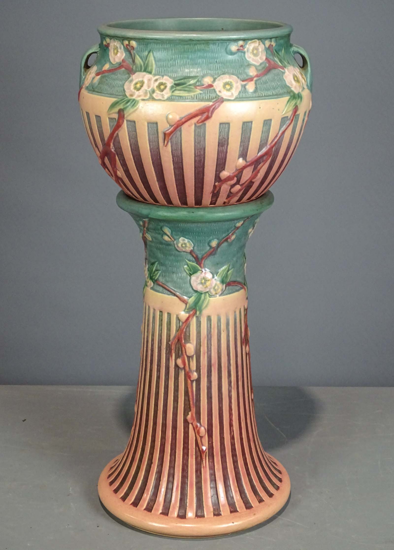 Roseville Jardiniere and Pedestal: Roseville Jardiniere and pedestal. Barbara Packer Collection. 25" Ht.. Hairlines on top, base overall good.
