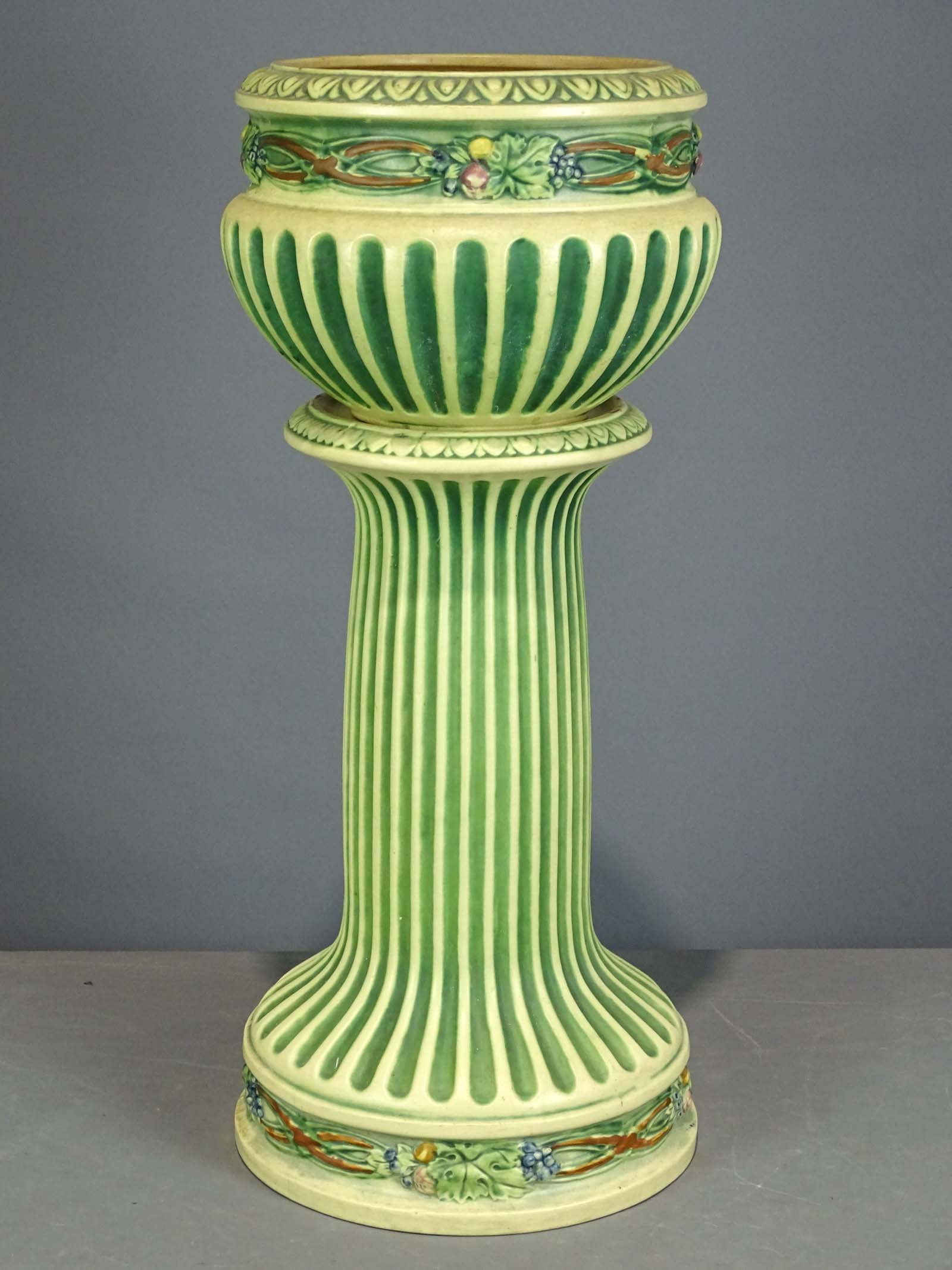 Roseville Jardiniere and Pedestal: Roseville Jardiniere and pedestal. Barbara Packer Collection. 29 1/2" Ht.. Base has hairline, otherwise good shape.