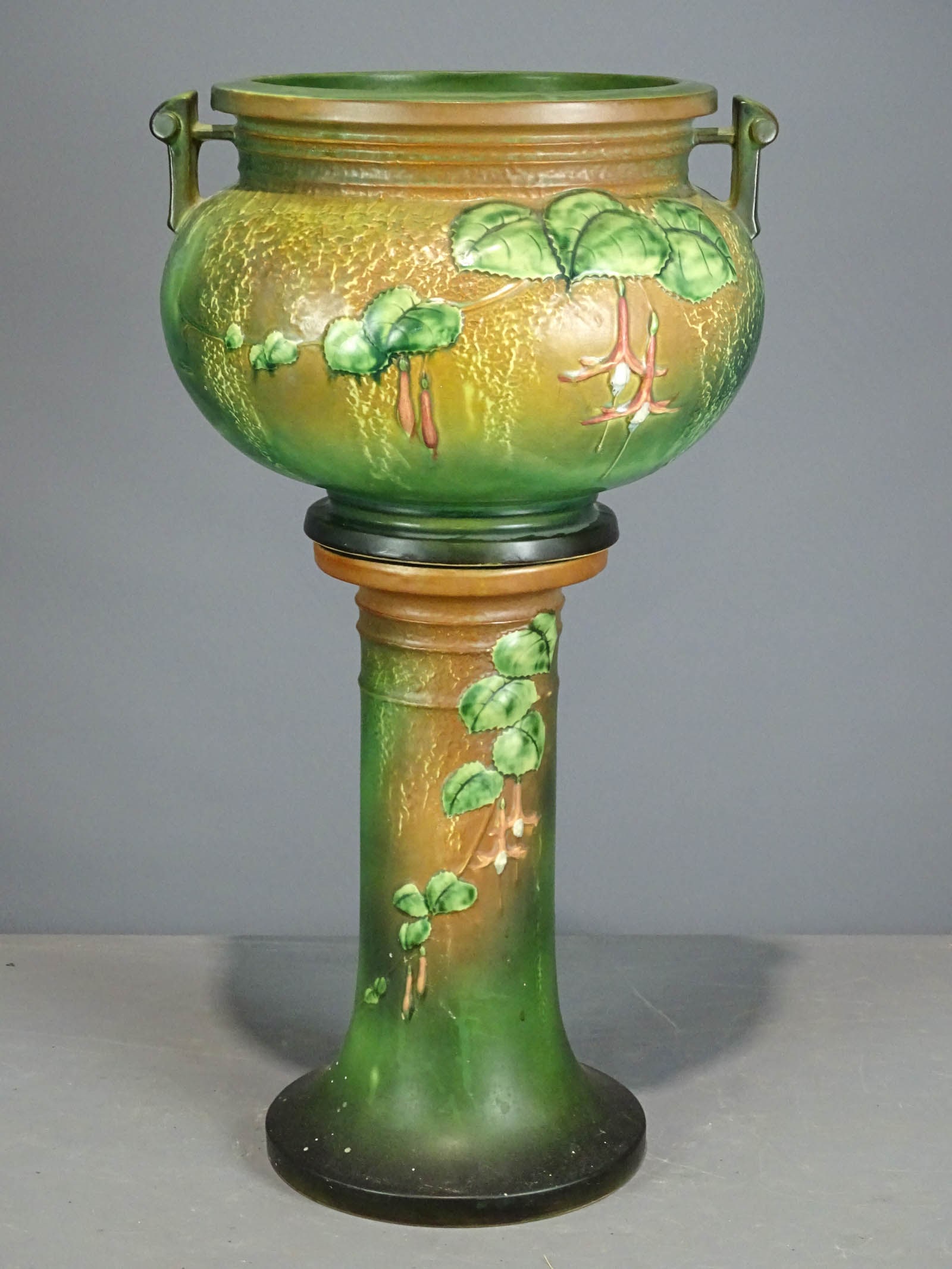 Roseville Jardiniere and Pedestal: Roseville Jardiniere and pedestal. Barbara Packer Collection. 28" Ht.. Chipped base, otherwise good condition.