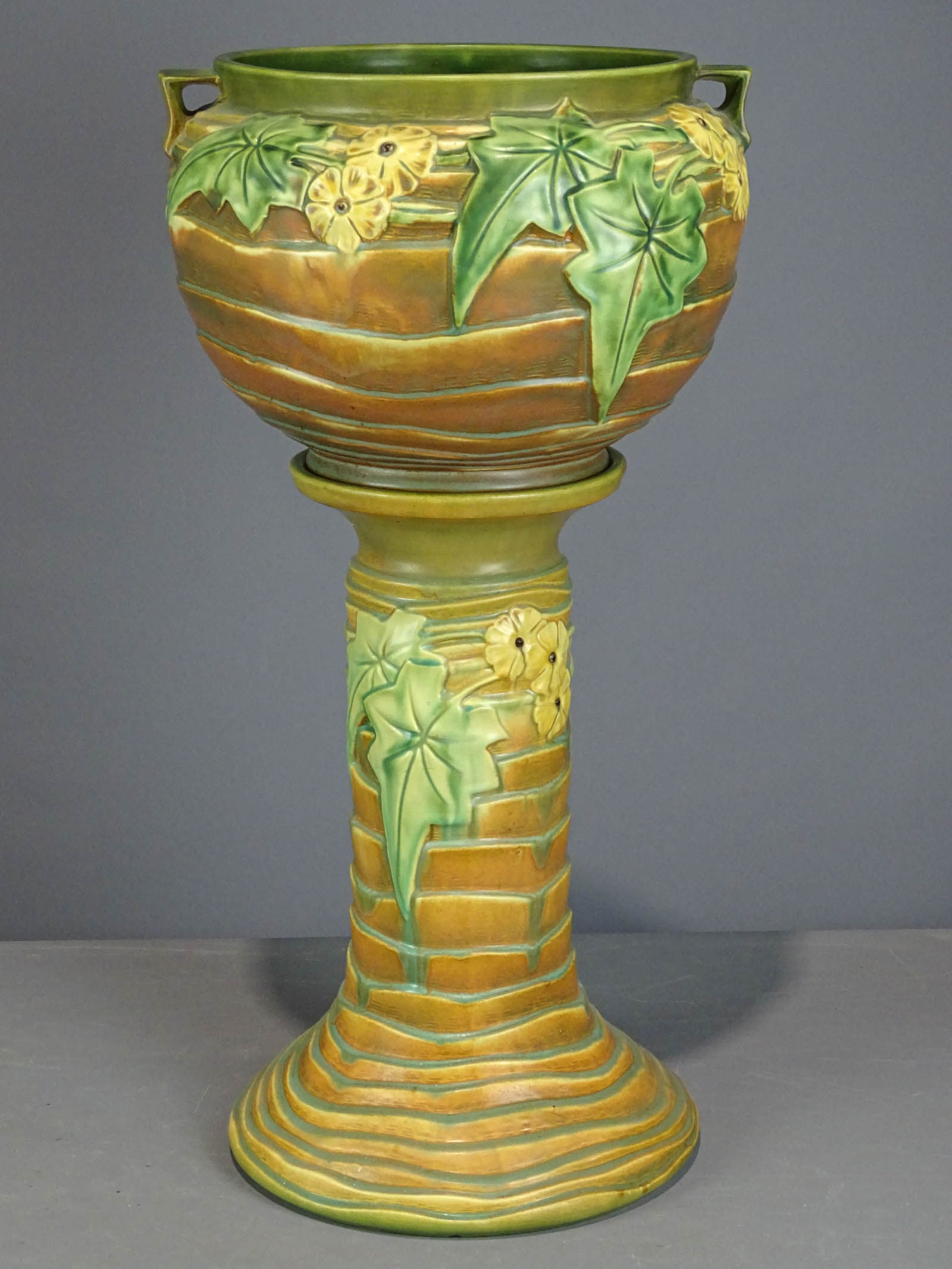 Roseville Jardiniere and Pedestal: Roseville Jardiniere and pedestal. Barbara Packer Collection. 30" Ht.. Good condition.
