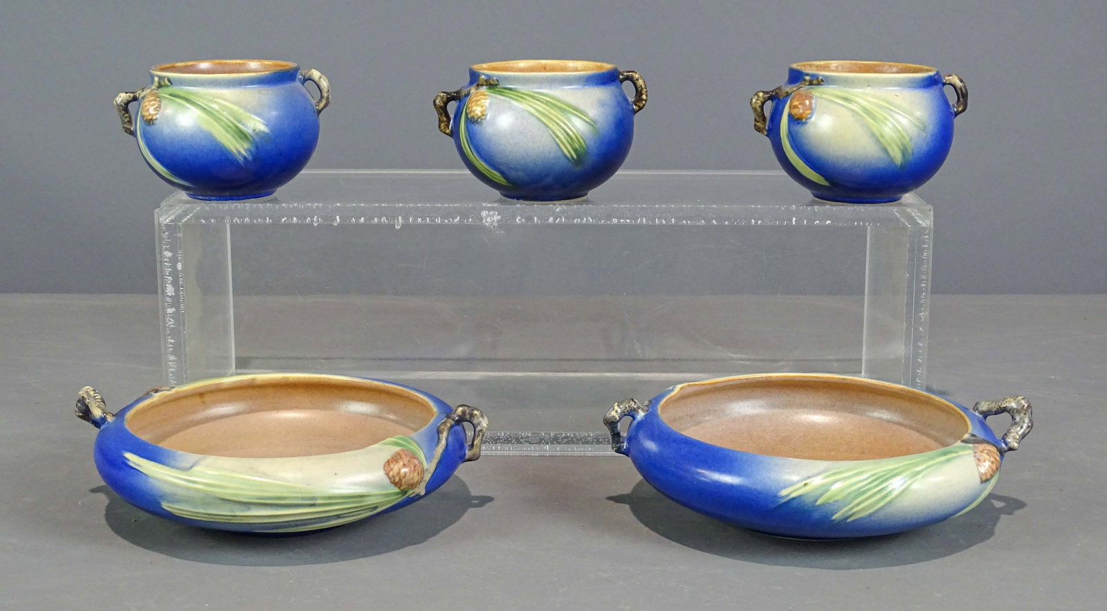 Roseville Lot: Lot (5) Roseville planters. Largest 9" D.. Barbara Packer collection. Good condition.