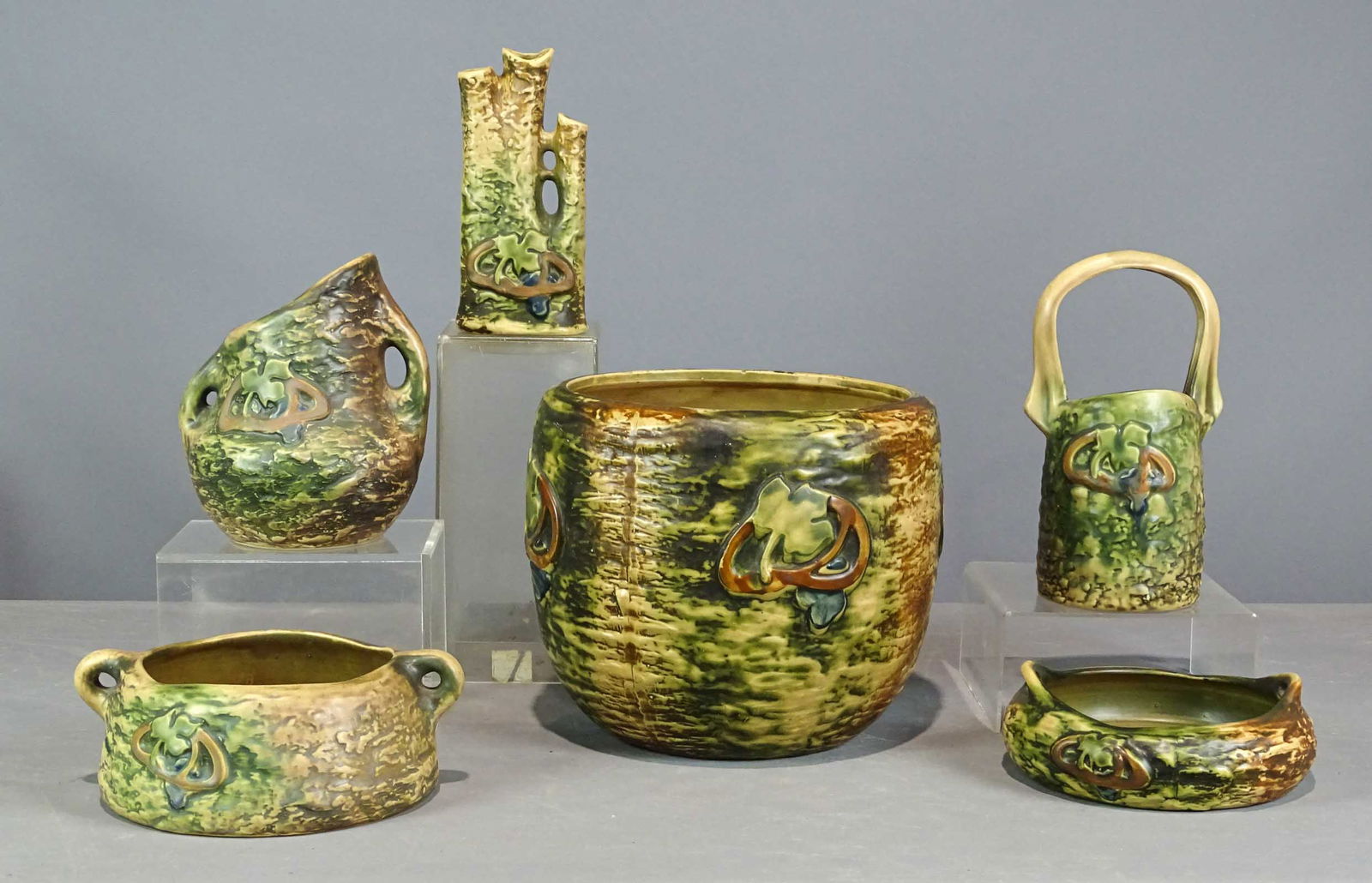 Roseville Lot: Lot (6) pieces of Roseville including planter (10 1/2" D., 10" Ht.), planters, vases. Tallest 9 1/2" Ht.. Barbara Packer collection. Good condition, minor white spots on planter.