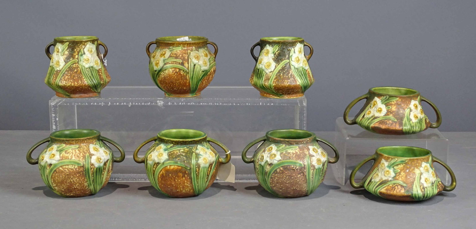 Roseville Lot: Lot (8) Roseville vases. Tallest 4 1/2" Ht.. Barbara Packer Collection. Good condition.