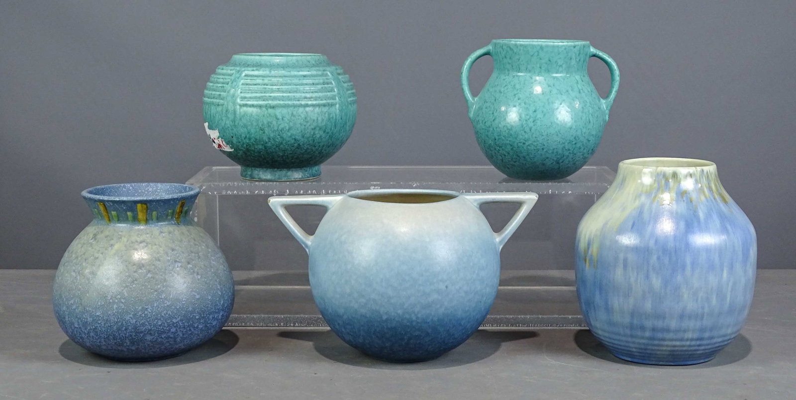 Roseville Lot: Lot (5) Roseville vases. Tallest 8" Ht.. One has flea bites on handle. Barbara Packer Collection. Good condition.