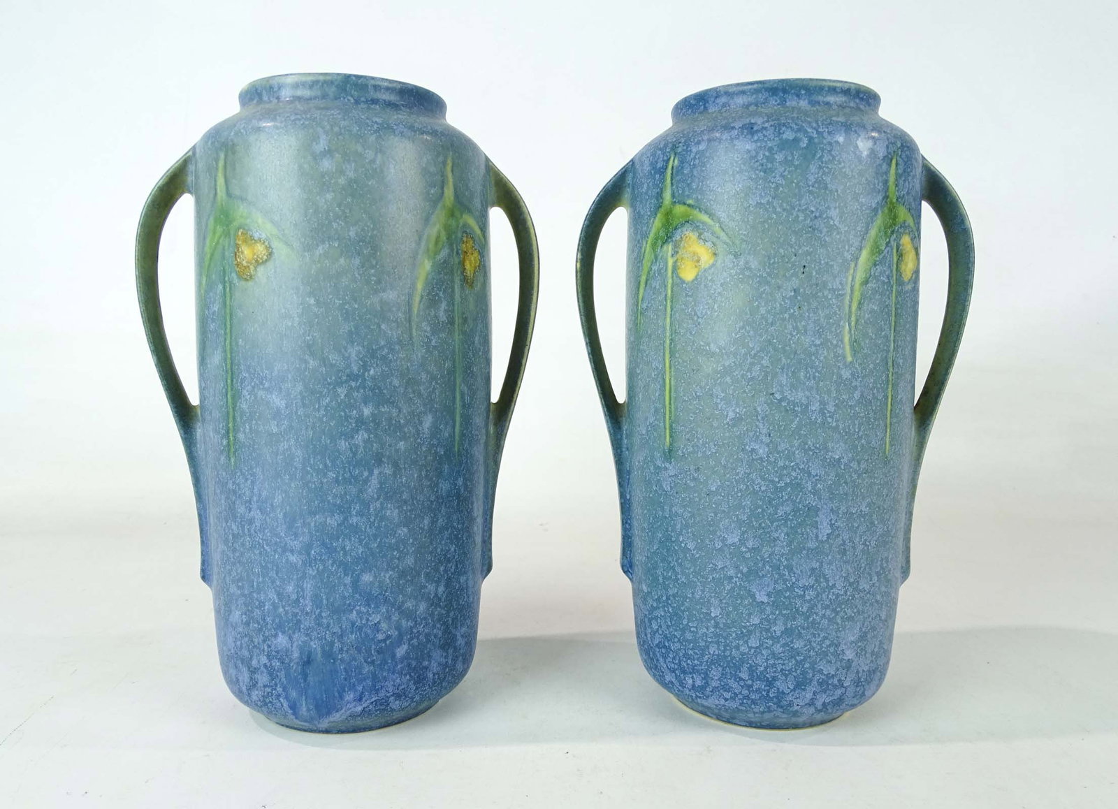 Roseville Lot: Pair of Roseville vases. 9" Ht.. Barbara Packer Collection. Good condition.