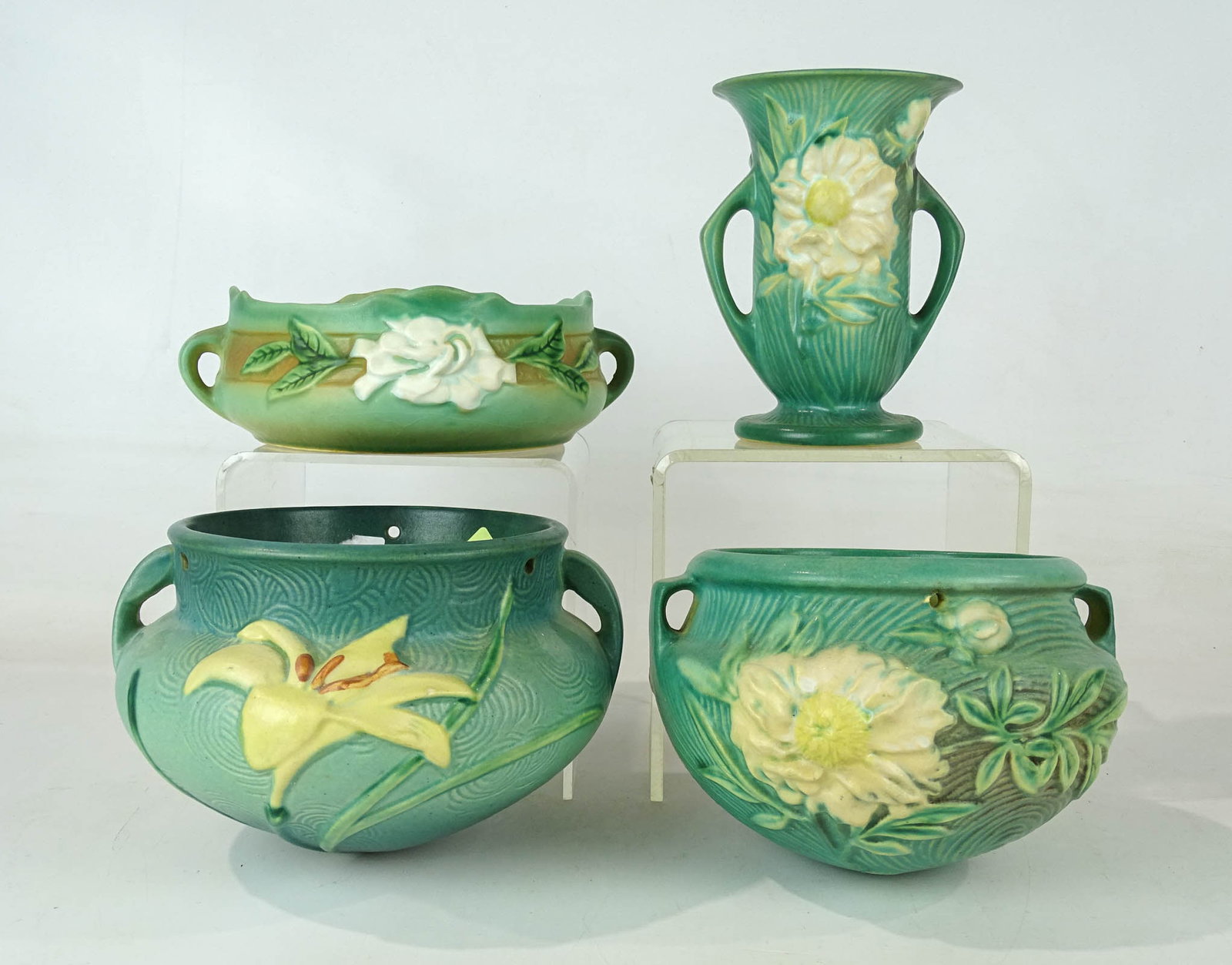 Roseville Lot: Lot (4) pieces of Roseville including (2) hanging pots (7" D., 6" Ht.), vase (6 1/2" Ht.), bowl (7" D.). Good condition. Barbara Packer Collection.