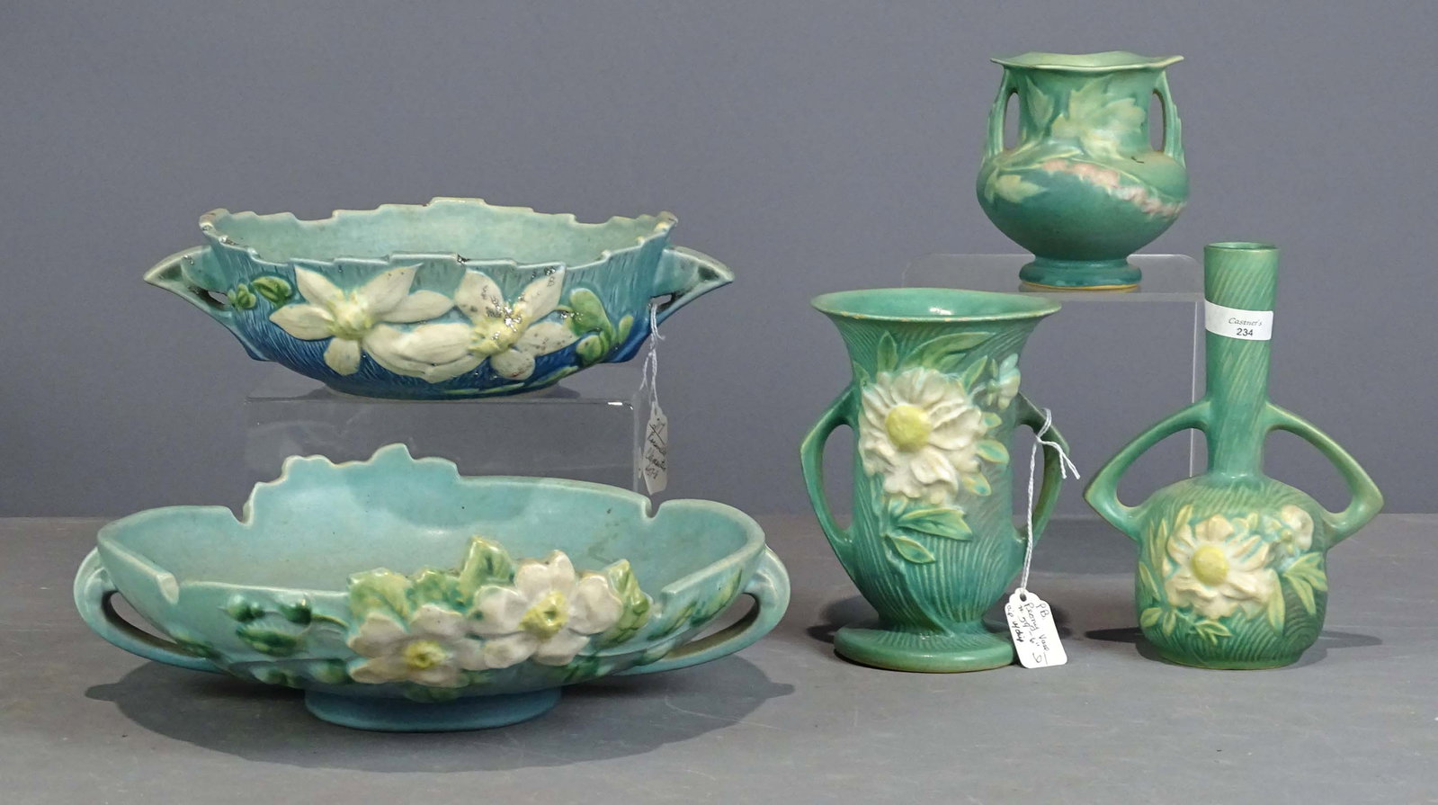 Roseville Lot: Lot (5) pieces of Roseville including (3) vases (tallest 6" Ht., (2) have minor roughness to edges of rim), bowl (11" D.), bowl (8" D., has sparkles on it, as is). Barbara Packer Collection.