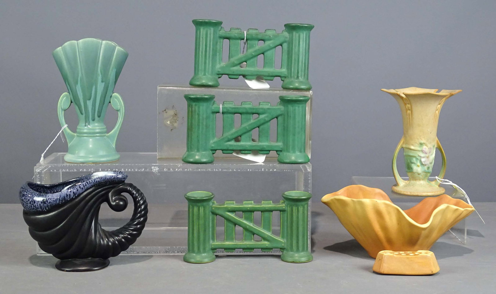 Roseville Lot: Lot (7) pieces of Roseville including (3) double candle holders (8" L.), bowl (10" L.), frog, (2) vases (tallest 8" Ht.). Barbara Packer Collection. Good condition.