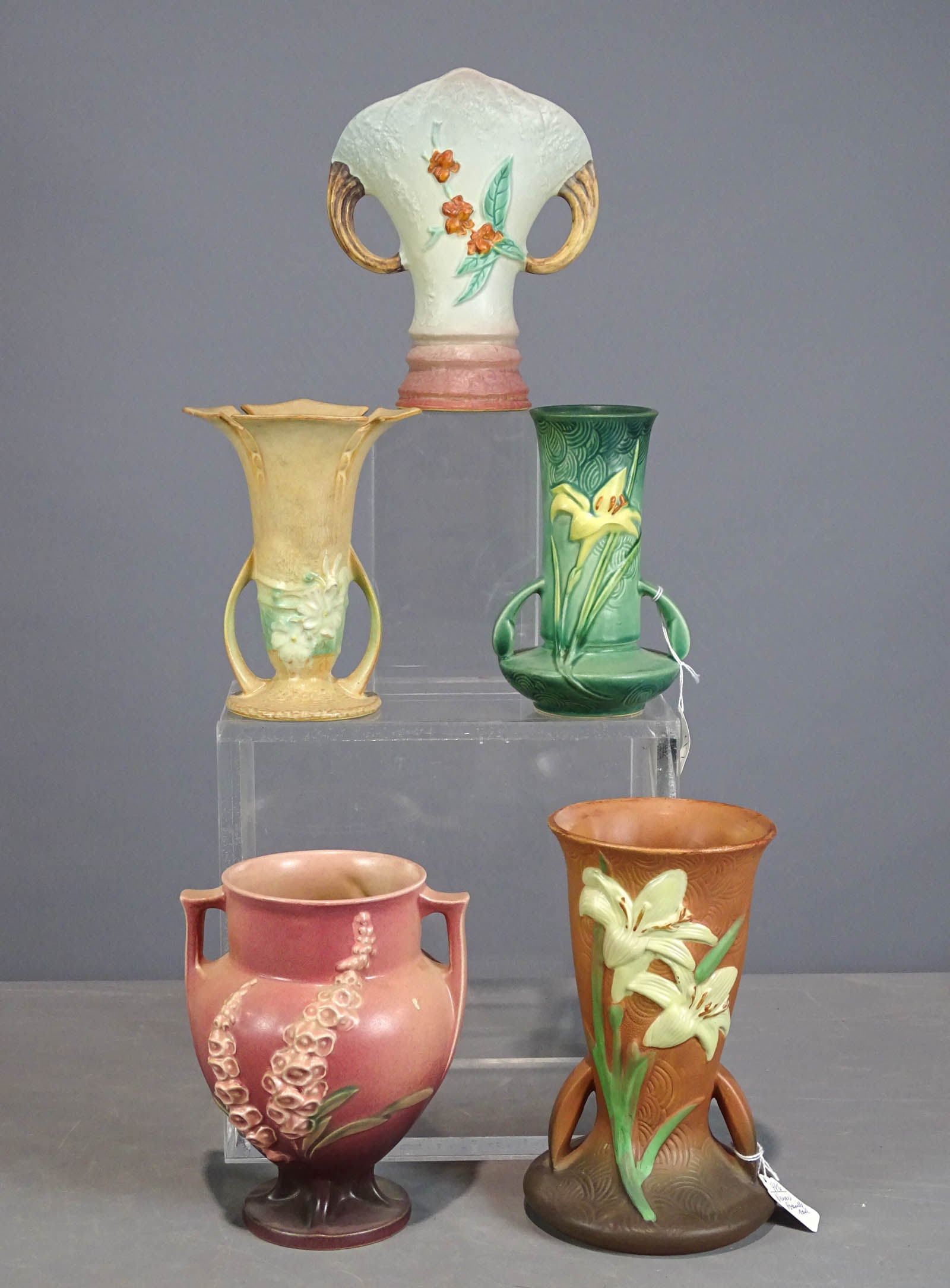 Roseville Lot: Lot (5) Roseville vases. Tallest 9 1/4" Ht. (rough edge rim), another has small rim chip, otherwise good condition. Barbara Packer Collection. Vase bottom right is of recent manufacture.