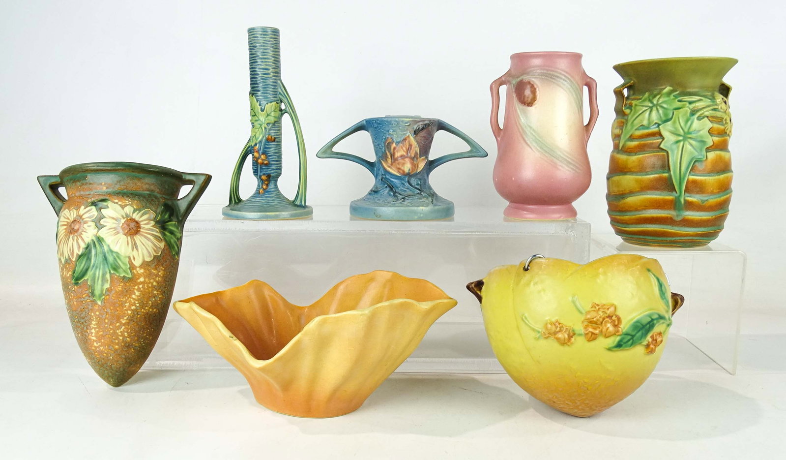 Roseville Lot: Lot (7) pieces of Roseville including wall pocket (8" L.), hanging planter (8" D.), planter (10"), (4) vases (tallest 7 1/2" Ht.). Barbara Packer collection. Good condition.