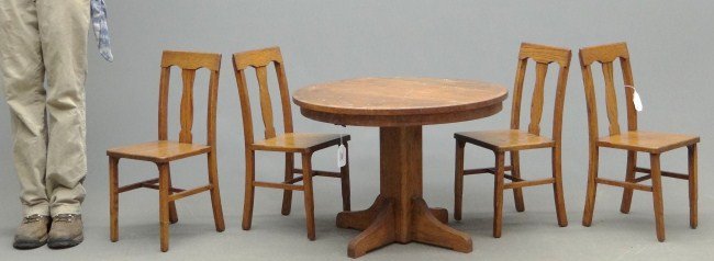 Child's Oak Table And Chairs: C. 1900's child's oak table and chairs.